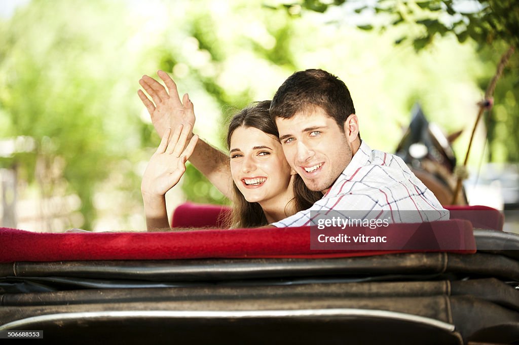 Young couple in a horse-drawn carriage