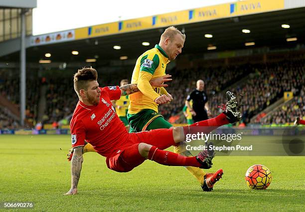 Steven Naismith of Norwich City is fouled by Alberto Moreno of Liverpool resulting in the penalty kick during the Barclays Premier League match...