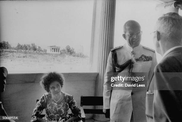 King Paul and wife the Queen greeting others and talking to guests during dedication ceremonies of Athenian Agora.