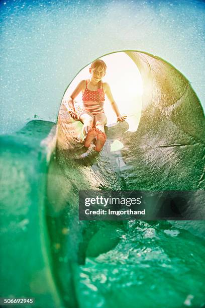 little girl in water park slide - water slide stock pictures, royalty-free photos & images