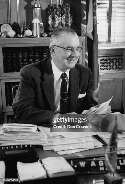 Mayor of Montgomery, W. A. Gayle, sitting in his office, smiling over telegrams approving actions to break bus boycott.