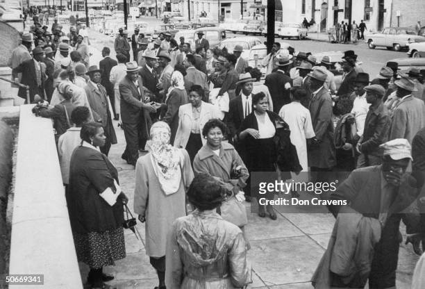 Group of African Americans, standing in front of Capitol Building steps, during bus boycott.