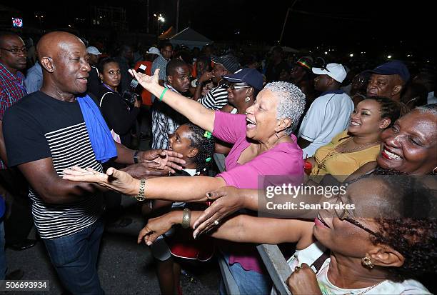 Keith Christopher Rowley , Prime Minister of Trinidad & Tobago, greets admirers in the audience at the semi-finals of Panorama in the Queen's Park...