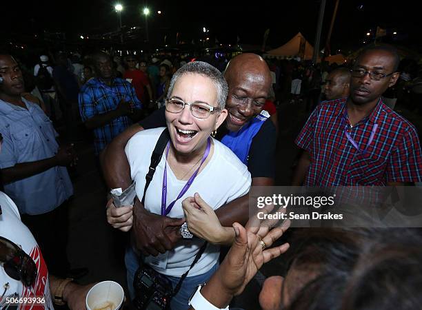 Keith Christopher Rowley , Prime Minister of Trinidad & Tobago, hugs Maria Nunes at the semi-finals of Panorama in the Queen's Park Savannah during...