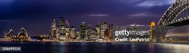 sydney cbd and harbor illuminated at night - bridge architecture up close night stock pictures, royalty-free photos & images