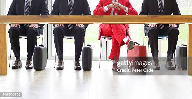 four men sat at table, one in red suit - candidate selection stock pictures, royalty-free photos & images