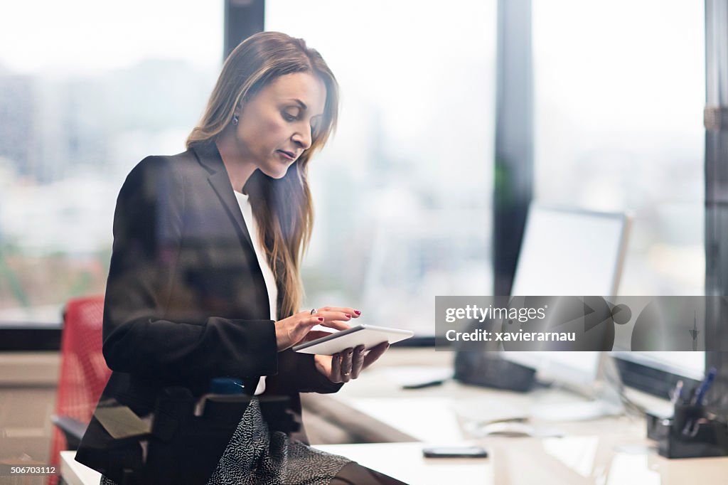 Businesswoman working with a digital tablet