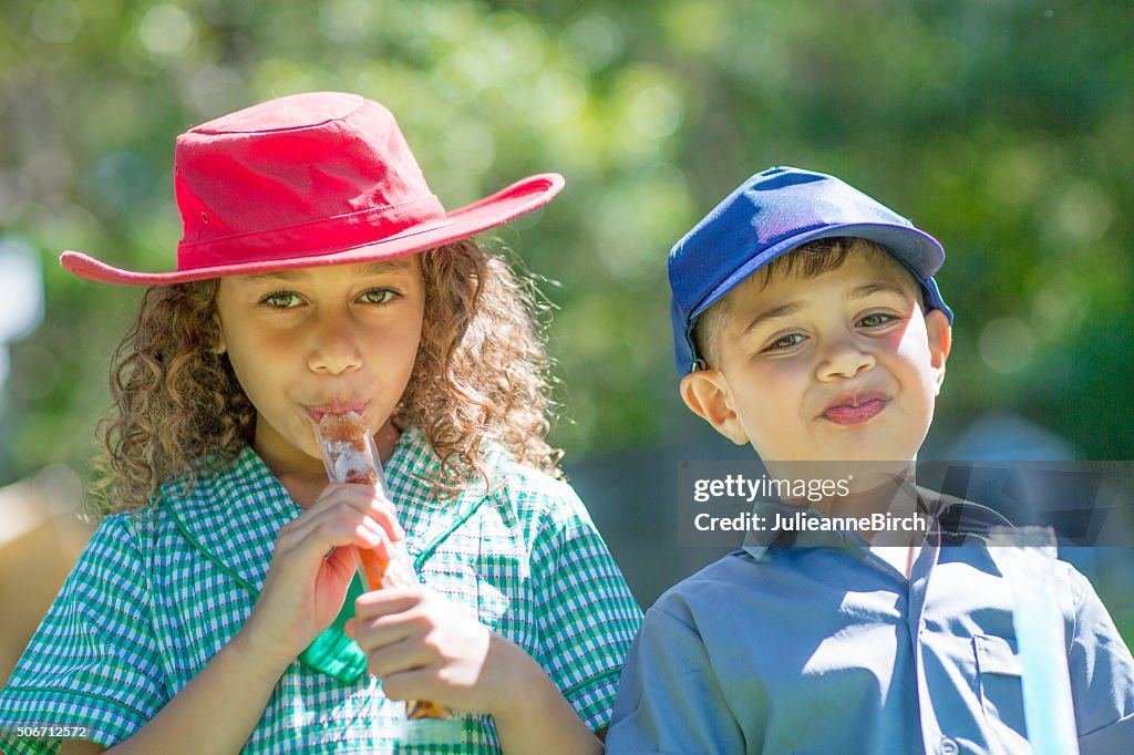 Cheeky children and ice pops