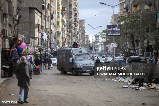 Members of the Egyptian police special forces patrol streets in al-Haram neighbourhood in the southern Cairo Giza district on January 25, 2016 in...