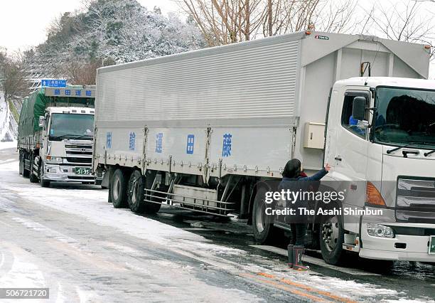 Trucks are stranded on the frozen road on January 25, 2016 in Yawatahama, Ehime, Japan. Low temperatures also set a record at many observatories...