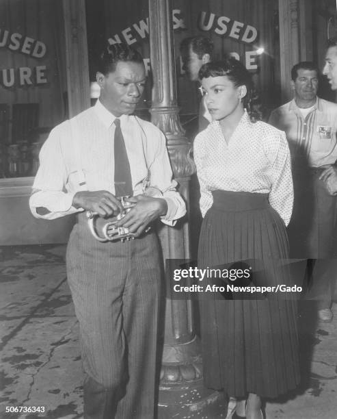 Singer and Jazz musician Nat King Cole and African-American playwright, actress, poet and activist Ruby Dee during filming of the movie St Louis...