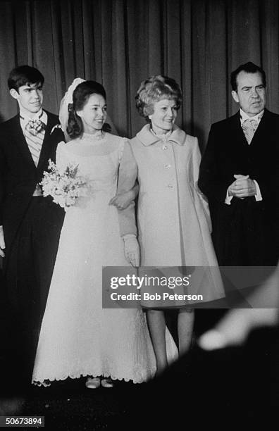 Husband David Eisenhower and wife Julie after their wedding ceremony with her parents President-elect Richard Nixon & wife Pat .