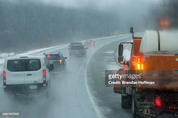 Democratic presidential candidate Hillary Clinton's motorcade travels through a snowstorm on January 25, 2016 en route to Oskaloosa, Iowa. The...