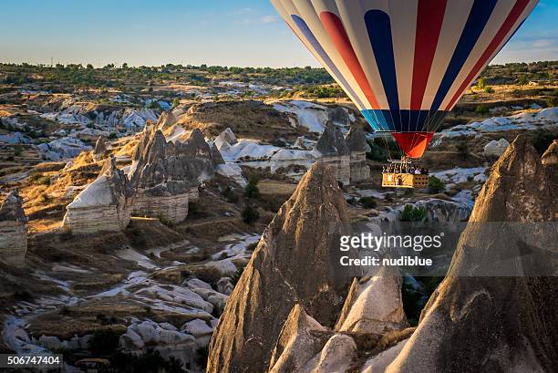 fire balloon on the rock - hot air balloon ride stock pictures, royalty-free photos & images