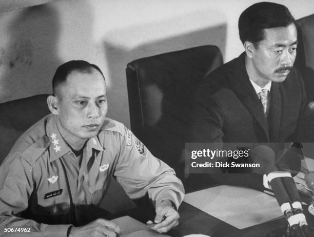 Prime Minister Nguyen Cao Ky and Defense Minister Gen. Nguyen Huu Co holding a news conference.