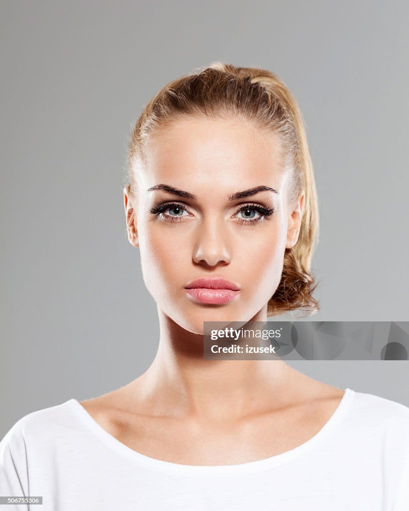Beautiful blonde young woman, close up of face