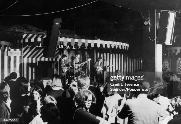 Pop group performs live on stage during a teenage dance and concert sponsored by pirate radio station Radio London at the Marquee Club in Wardour...