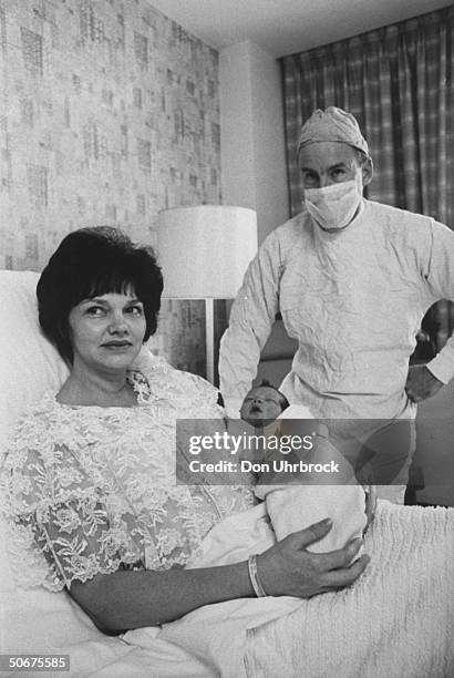 Astronaut James A. Lovell with wife & newborn son in hospital.