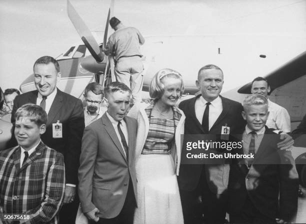 Astronauts James A. Lovell, Jr. And Frank Borman greeting their families upon arriving after their space flight.