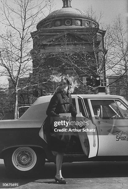 Barnard college student arriving at class in cab.