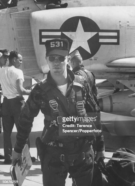 United States Marine Corps pilot exits the cockpit of a McDonnell Douglas F-4B Phantom II jet fighter after arriving at Da Nang Air Base in South...