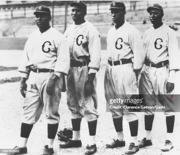 Oscar Charleston, Josh Gibson, Ted Paige and Judy Johnson posing for a group photo during a Negro League baseball game, San Francisco, California,...