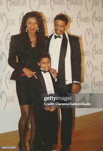 Natalie Cole, Herbie Hancock and Robbie Yancy standing on stage during the 1989 American Music Awards, Los Angeles, California, January 30, 1989.