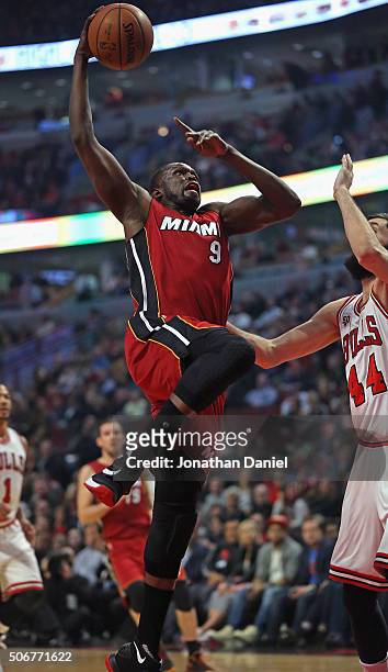 Luol Deng of the Miami Heat goes up for a shot against Nikola Mirotic of the Chicago Bulls at the United Center on January 25, 2016 in Chicago,...