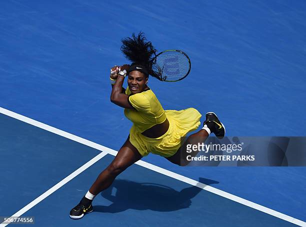 Serena Williams of the US plays a backhand return during her women's singles match against Russia's Maria Sharapova on day nine of the 2016...
