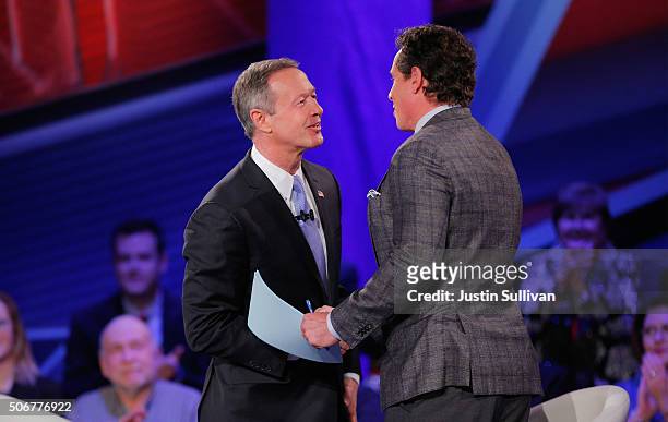Democratic presidential candidate Martin O'Malley greets moderator Chris Cuomo during a town hall forum hosted by CNN at Drake University on January...