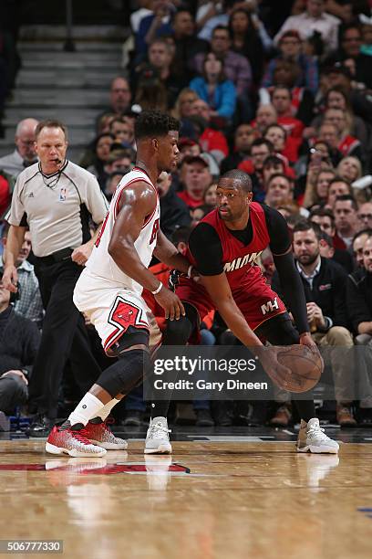 Dwyane Wade of the Miami Heat defends the ball against Jimmy Butler of the Chicago Bulls during the game on January 26, 2016 at United Center in...