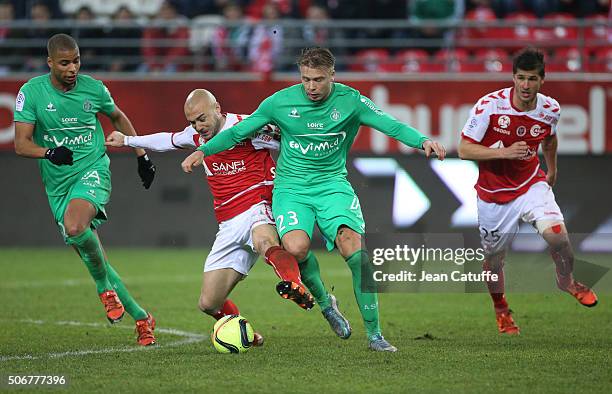 Kevin Monnet-Paquet of Saint-Etienne, Jaba Kankava of Reims, Alexander Soderlund of Saint-Etienne, Anthony Weber of Reims in action during the French...