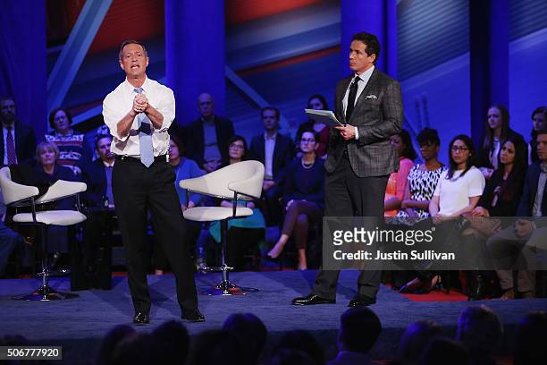 Democratic presidential candidate Martin O'Malley and moderator Chris Cuomo participate in a town hall forum hosted by CNN at Drake University on...