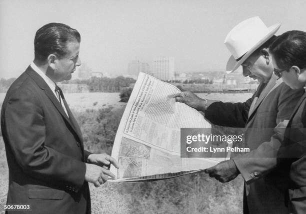 Mayor Felix Alfonso Lugo and Richard Telles , examining newly acquired Mexican territory across Rio Grande.