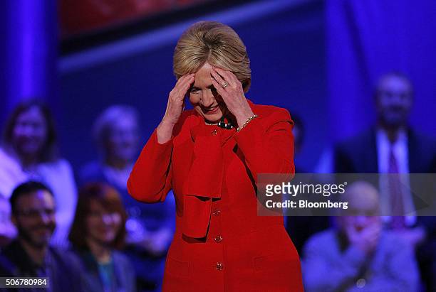 Hillary Clinton, former Secretary of State and 2016 Democratic presidential candidate, touches her hands to her head during a Democratic Town Hall...