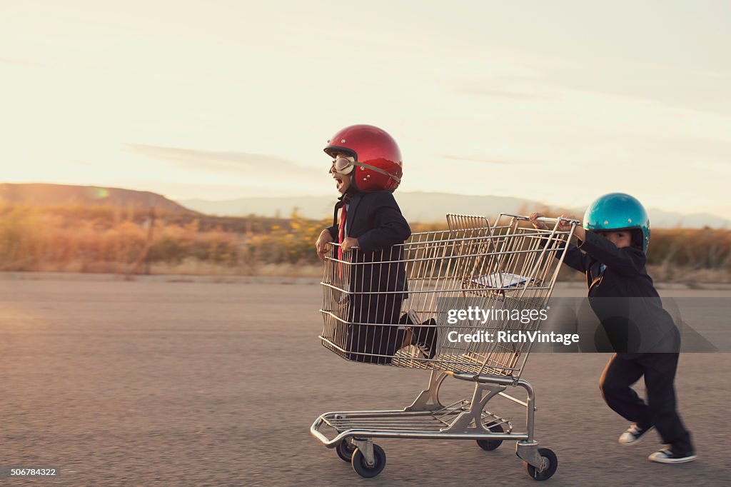 Young Business Boys Race in Shopping Cart