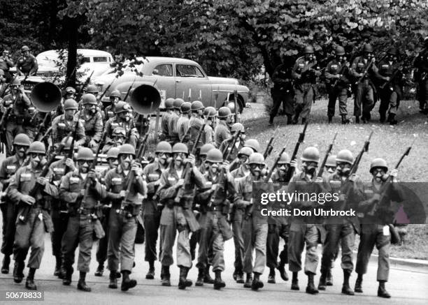 Troops patroling streets during Univ. Of Mississippi's anti-integration riots.