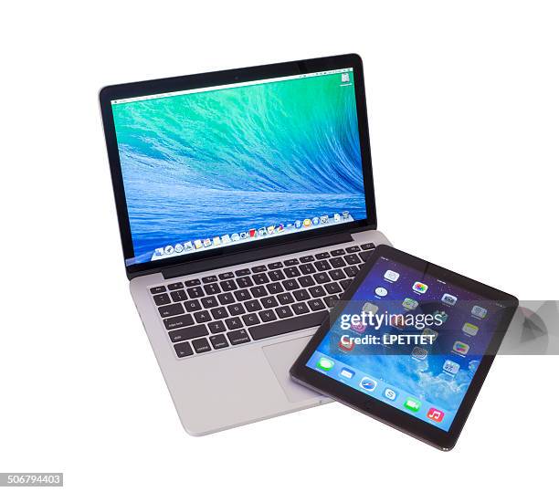 macbook pro retina and ipad air - mac laptop stock pictures, royalty-free photos & images