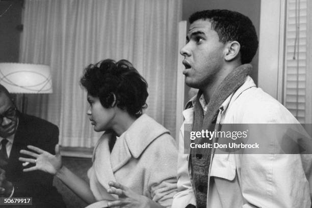 African American students Charlayne Hunter and Hamilton Holmes , talking after being suspended from the University of Georgia.