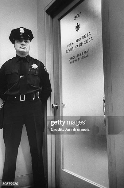 Police guarding Cuban Consul-General during the time of diplomatic break between US and Cuba.