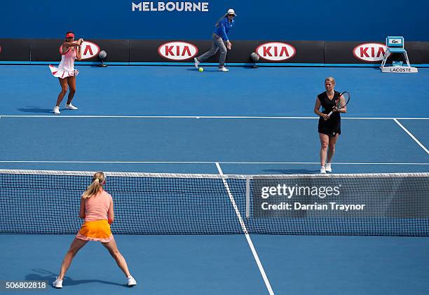 Kim Clijsters of Belgium and Iva Majoli of Croatia comepete in their match against Nicole Bradkte of Australia and Barbara Schett of Austria during...