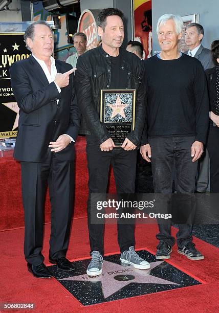 Actor Garry Shandling, actor David Duchovny and writer/director Chris Carter attend the star on the Hollywood Walk of Fame ceremony honoring David...