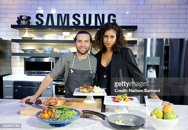 Chef Marcel Vigneron plates and offers Aluna Francis of AlunaGeorge the perfect bite showcasing Samsung Black Stainless Steel home appliances in the...