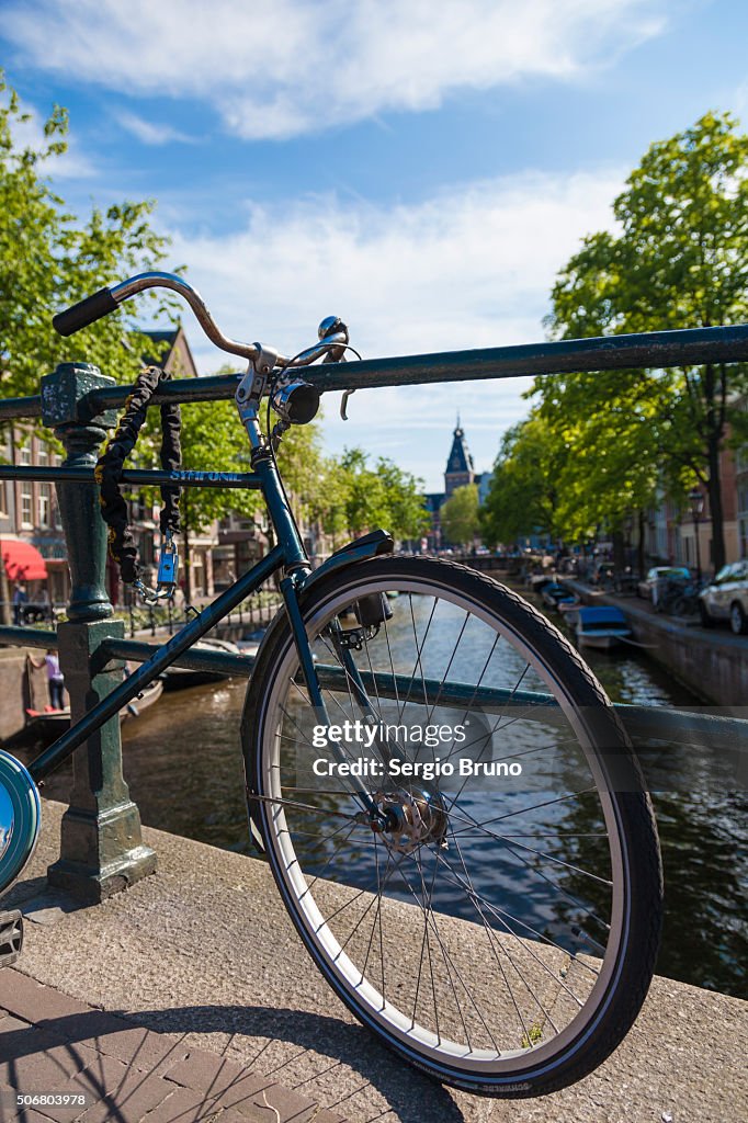 Bike with Amsterdam canals as background