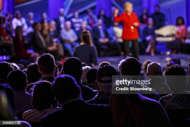 Audience members listen as Hillary Clinton, former Secretary of State and 2016 Democratic presidential candidate, speaks on stage during a Democratic...