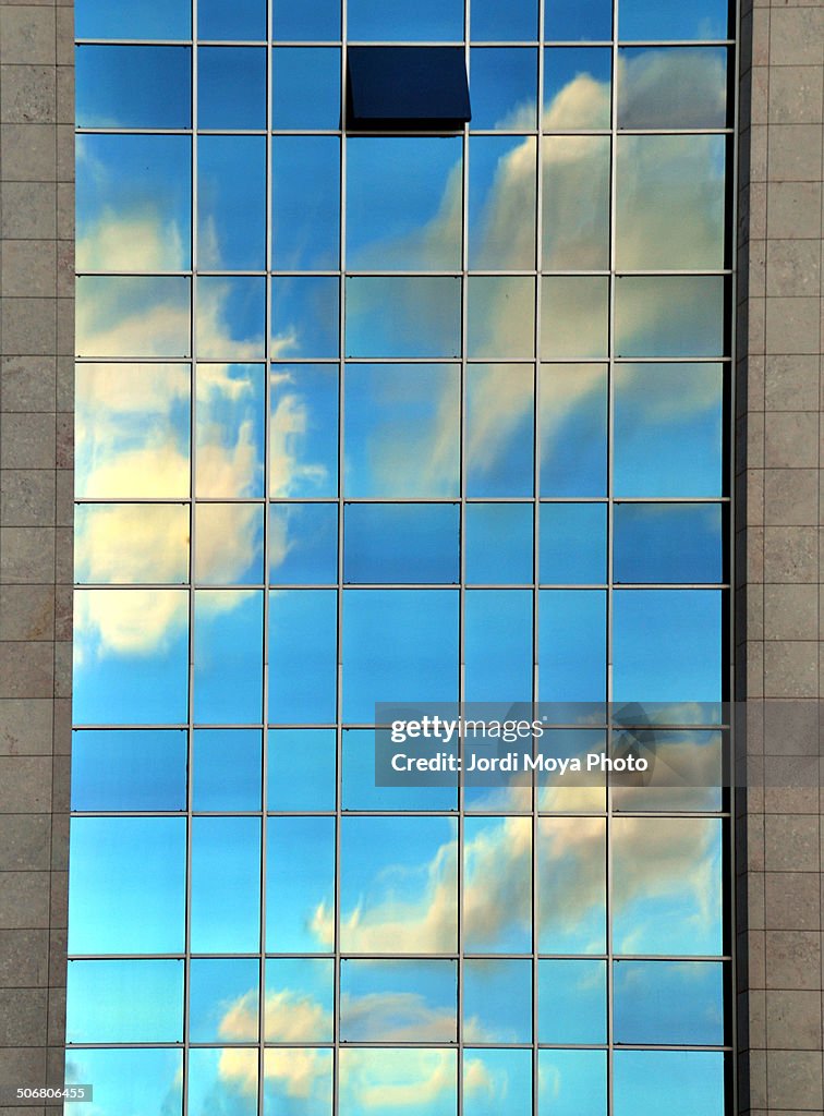 Clouds reflected in a business building