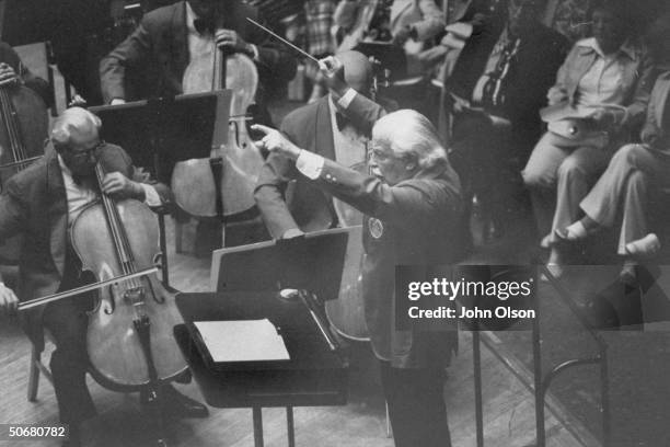 Boston Pops conductor Arthur M. Fielder conducting the orchestra during a performance.