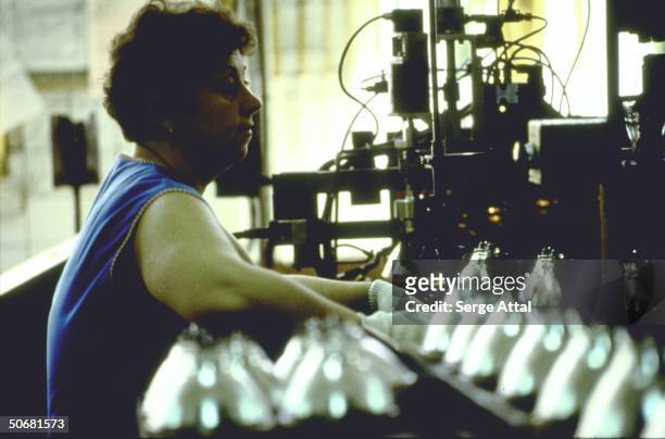 Woman working in Tungsram light bulb factory, a venture of US giant General Electric .