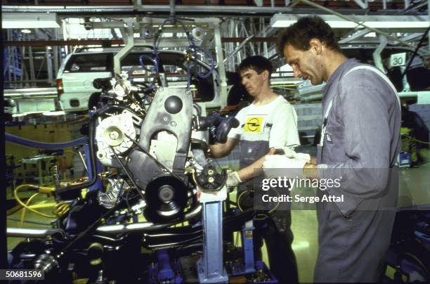 Cars being assembled in Opel factory, a GM subsidiary.