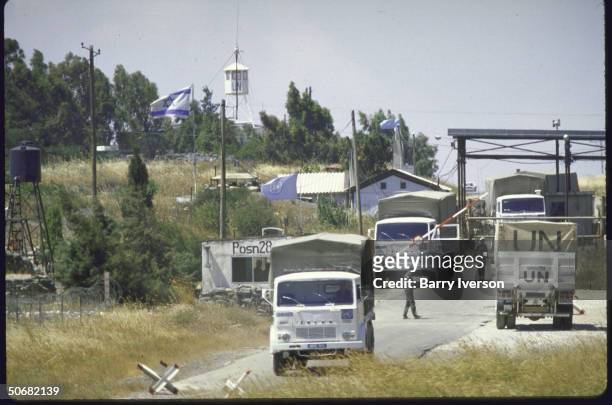 Ruined Golan Heights village, Quneitra, ghost town on Syrian-Israeli Demarcation Line. UN trucks across Demilitarized Zone.